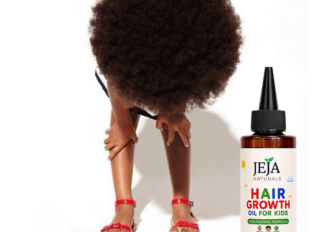 Child bending forward to show full natural hair beside a bottle of JEJA Naturals Hair Growth Oil for Kids